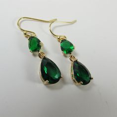 Emerald Green Crystal Earrings, Emerald Green Teardrop Earrings, Sparkly Dangle Earrings, Green Wedding Jewelry, Green Statement Earrings. These beautiful and elegant drop earrings made with high quality, sparkly 24k gold framed, faceted green glass crystals hang from tarnish resistant French ear hooks. These earrings are classic and elegant. Will make an excellent gift for yourself or friends. Measurements: The total length from the top of the hook to bottom - 1.37 inches (35mm) approximately. Classic Green Drop Jewelry, Green Drop Earrings For Anniversary, Classic Green Drop Earrings, May Birthstone Teardrop Jewelry For Parties, Elegant Long Drop May Birthstone Jewelry, Elegant May Birthstone Long Drop Jewelry, Green Drop Crystal Earrings, Green Long Drop Earrings For Formal Occasions, Green Drop Earrings For Formal Occasions