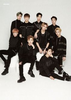 the group is posing for a photo in their black outfits, all dressed up and ready to