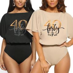 two women wearing bodysuits with the number fifty five printed on them, one in black and one in beige