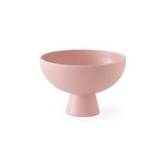 a pink bowl sitting on top of a white table