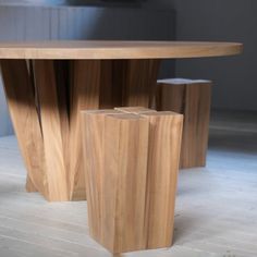 a wooden table sitting on top of a hard wood floor