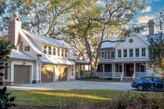 two large white houses sitting next to each other