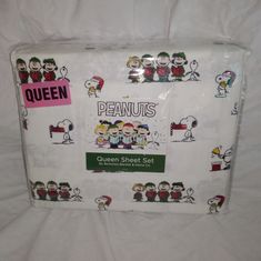 the queen sheet set has been made with peanuts and other cartoon characters on white sheets