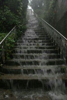 a set of stairs with water cascading down them