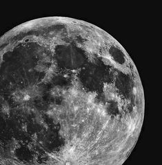 the full moon is shown in black and white