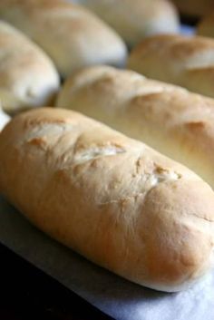 several loaves of bread sitting on top of a table