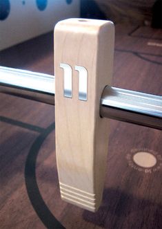 a wooden object with the letter m on it