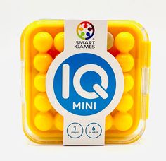 small yellow candies in a plastic container with the word q on it's side