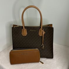 Nwt Authentic Michael Kors Handbag And Wallet Set. Never Used Comes With Dust Bag Nwt Reposhing This Item I Purchased From @Addingvalue. Loved It, But Ready To Rotate For Something New. Questions? Leave A Comment Below! Michael Kors Brown Satchel For Travel, Michael Kors Brown Travel Satchel, Michael Kors Rectangular Shoulder Bag In Cognac, Michael Kors Brown Bag With Removable Pouch, Michael Kors Rectangular Cognac Shoulder Bag, Michael Kors Brown Satchel For On-the-go, Michael Kors Brown Satchel For Daily Use, Michael Kors Brown Daily Wallet, Michael Kors Brown Everyday Bags