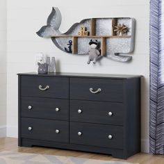 a black dresser with silver handles and drawers