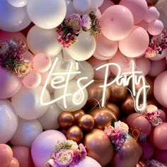 balloons and flowers with the words let's party written on them in white letters