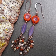 Rustic, bohemian woodland dangles - a colorful combination of purple and red Czech glass with a cluster of carnelian stones, copper leaf beads and more tiny Czech glass beads. Finishing the earrings are antiqued copper accents and long and elegant copper plated ear wires. The long earrings are lightweight despite their size. These earrings are a pretty and unique choice that would be a sweet treat for yourself or a gift for a loved one. Earring Size: 3 1/4" including the ear wire  Flower Bead: 1 Ears Pierced, Leaf Beads, Copper Leaf, Copper Accents, Earring Ideas, Carnelian Stone, Earrings Inspiration, Earrings Long, Cluster Earrings