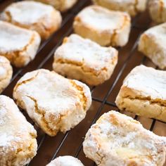 powdered sugar cookies cooling on a wire rack