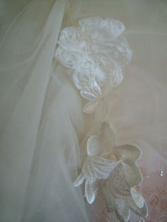 Ivory wedding dress wrap with many layers of tulle and gorgeous lace appliques at the tie front. Can be worn many ways. Very high fashion and very full. make a simple gown over the top! Also available in black tulle. Tulle Wedding Veil With Lace Trim, Wedding Veil With Lace Trim In Tulle, Cream Tulle Wedding Veil, Tulle Lace With Lace Trim For Wedding, Wedding Lace With Tulle And Lace Trim, Elegant Floral Applique Lace For Wedding, Cream Lace Wedding Veil, Wedding Veil With Lace Trim, White Delicate Lace Veil For Ceremony