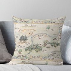 a map pillow sitting on top of a couch