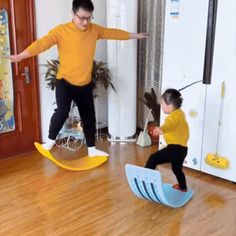 a young boy and girl are playing in the living room