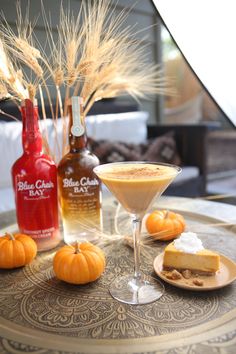 a table topped with drinks and desserts on top of it