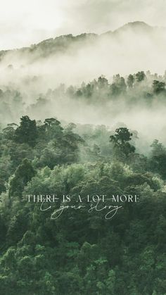 the words there is a love more are in front of trees and foggy hills