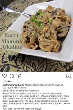 a white plate topped with pasta covered in mushrooms