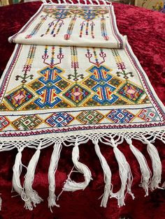 🏺 This stunning long handmade Cretan embroidery is a true masterpiece of traditional craftsmanship.  Made in the 1970s on Greek Arachovitic fabric - a fabric known for its difficulty to embroider and durability - this one-of-a-kind piece features traditional colorful Cretan motifs. The expert use of Arachovitic fabric highlights the skill and dedication of the artisan who crafted this embroidery. Handmade white macrame endings adorn both sides. Whether displayed as a centerpiece or draped over Greek Embroidery, Embroidered Table Runner, Vintage Embroidery, The Expert, Embroidery Art, Table Runner, Fiber Art, Needlework, Table Cloth