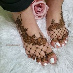 the feet are decorated with henna and flowers