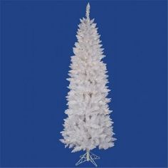 a white artificial christmas tree on a blue background