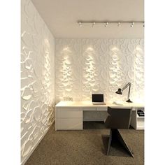 an office with white walls and desks in front of a large wallpapered pattern