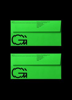 two green envelopes with the letter gn printed on them, side by side