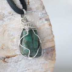 Live bold with compassion and truth to your heart with this emerald gemstone necklace. Handcrafted with care, the detailed sterling silver design offsets a polished raw emerald. Each emerald necklace is handcrafted with care and a deep respect for the crystal. You can wear the raw stone pendant on either side due to the pendant’s reversible design. Each stone ranges in size and shape creating a unique pendant for you that won’t be duplicated.- The stone is 40-55 carat real, authentic, naturally Silver Emerald Pendant Necklace As Gift, Spiritual Silver Emerald Necklace, Spiritual Silver Necklace With Emerald, Silver Emerald Gemstone Necklace As Gift, Silver Emerald Gemstone Necklace For Gift, Silver Emerald Necklace As A Gift, Silver Emerald Necklace Gift, Spiritual Style Emerald Pendant Necklace, Spiritual Emerald Necklace For May Birthstone