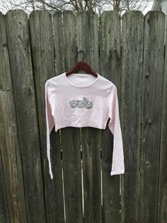 This a great top for anyone that loves motorcycles and wants to look great in summer. If you want to be comfortable and rock a bedazzled shirt, get this now. It is in good condition with just a small light stain on the back of the sleeve, pictured. There are no rips, holes or smells. Measurements: Pit to pit: 17 1/4 inches Collar to bottom front: 10 1/4 inches Collar to bottom back: 13 inches Sleeve Length (from collar): 26 1/2 inches Size on tag: no tag (measures like a small/medium) Fall Streetwear Biker Tops, Biker Style Tops For Fall Streetwear, Biker Style Tops For Streetwear In Fall, Biker Streetwear Tops For Fall, Graphic Print Tops For Summer Biker Events, Graphic Print Tops For Biker Events In Summer, Cotton Biker Top For Biker Events, Summer Biker Cotton T-shirt, Fitted Crew Neck Biker Top