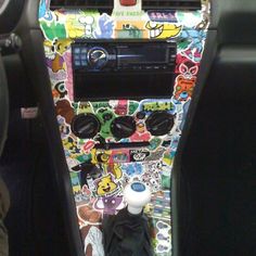 the interior of a car with stickers all over it