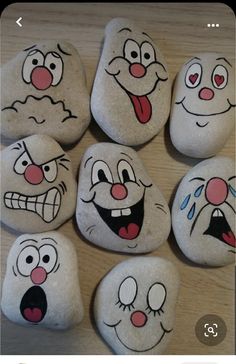 some rocks with faces painted on them