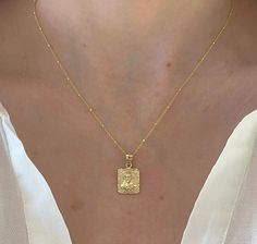 "14K Solid Yellow Gold Textured Rectangle Double Sided Jesus Christ And Virgin Mary Charm Necklace. A Beautiful Protection Charm Necklace Thats Perfect For Everyday Wear. Wear Alone Or Layered. This Charm Has The Option Of Coming With A High Quality Shiny And Bright 14K Yellow Gold Chain That Has A Beautiful Sparkle. The Perfect Gift To Give! Jewelry Comes In A Beautiful Gift Box Ready To Present. Model Is Wearing 16\" inch Chain ❤️All Jewelry Is New And Inspected For Quality Assurance. ❤️Jewelr Cross Gift, Gold Cross Necklace, Jesus Christus, Round Necklace, Dainty Gold Necklace, Sell Gold, Yellow Gold Chain, Gold Cross, Gold Texture