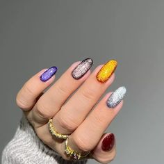 An easy way to make a simple Skittle mani look much more intricate is by opting for a velvet finish. We can't take our eyes off this purple, bronze, pumpkin, silver, and slate set. Easy Halloween Nails, Skittle Nails, Skittle Mani