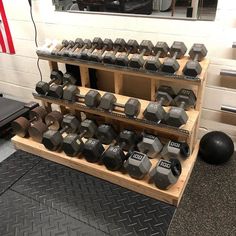 there are many dumbs on the shelves in this gym room, and one is for sale