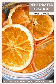 orange slices in a bowl with text overlay that says how to make dehydrated oranges