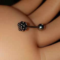 a close up of a fake ring with a ball on it's back end