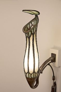 a lamp hanging from the side of a wall