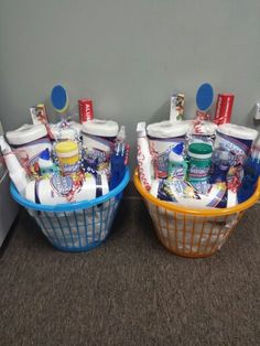 two baskets with toothbrushes and other items in them sitting next to each other