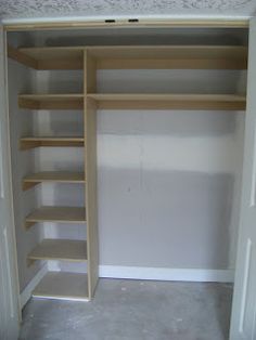 an empty walk in closet with shelving and shelves