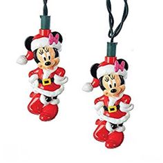 two mickey mouse christmas ornaments hanging from strings