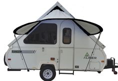 a camper trailer with an awning attached to it