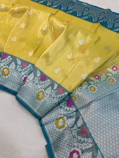 This is a very beautiful Pure banarasi katan tissue silk handloom saree Kadhyal weave border, Sona Rupa weave booties, golden n silver zari, paithani tilffi border, with  blouse piece.  Saree length - 5.5 mtr. Blouse - 1 mtr.  Dry clean only . Please note - color may be vary a little due to sunlight and photography . Please message us after purchasing in case you want fall and Pico done it not . No extra charges for fall and Pico but inform us . Blouse stitching is also available . Yellow Tussar Silk Dupatta With Border, Yellow Tussar Silk Saree With Border, Yellow Katan Silk Saree With Border, Yellow Katan Silk Traditional Wear With Border, Tissue Silk Traditional Wear With Border For Eid, Festival Tissue Silk Traditional Wear With Border, Festival Traditional Tissue Silk Wear With Border, Yellow Paithani Silk Saree With Border, Yellow Paithani Silk Traditional Wear With Border