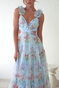 Alma Floral Print Tulle Maxi Dress | Blue Summer Tie Back Maxi Dress For Prom, Summer Prom Maxi Dress With Tie Back, Light Blue Party Dress With Ruffled Straps, Blue Prom Dress With Ruffled Straps, Blue Chiffon Maxi Dress With Spaghetti Straps, Blue Backless Dresses With Ruffles, Blue Backless Dress With Ruffles, Blue Dress With Tie Back And Ruffled Straps, Floor-length Summer Tulle Maxi Dress