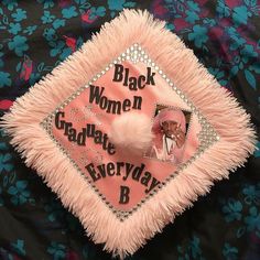 a pink and black graduation cap with the words, black women graduate everyday b