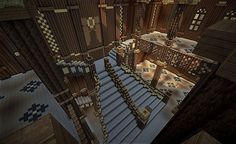 an aerial view of a building in minecraft with stairs and railings on each floor