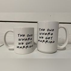 two coffee mugs with the words, the one where we get married on them