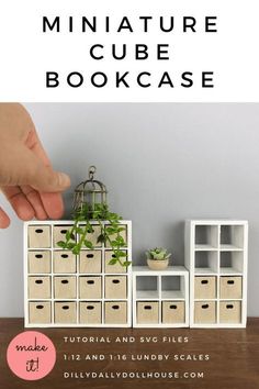 the miniature cube bookcase is made from cardboard boxes and has plants growing out of it