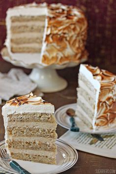 two slices of cake sitting on plates next to each other with one slice cut out