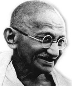 an old black and white photo of a man with glasses